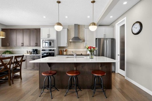 144 Sundown View, Cochrane, AB - Indoor Photo Showing Kitchen With Stainless Steel Kitchen With Upgraded Kitchen