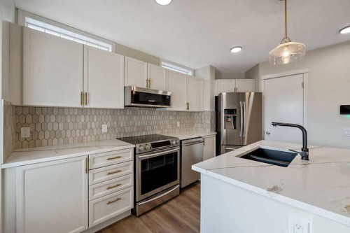 14 Tuscany Springs Rise Nw, Calgary, AB - Indoor Photo Showing Kitchen With Double Sink With Upgraded Kitchen