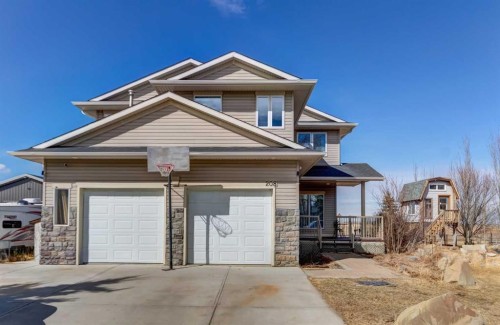 208 Railway Avenue, Cheadle, AB - Outdoor With Facade