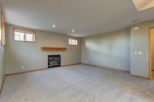 208 Railway Avenue, Cheadle, AB - Indoor With Fireplace