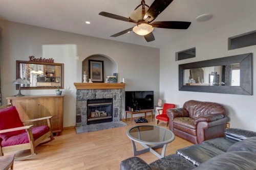 208 Railway Avenue, Cheadle, AB - Indoor Photo Showing Living Room With Fireplace