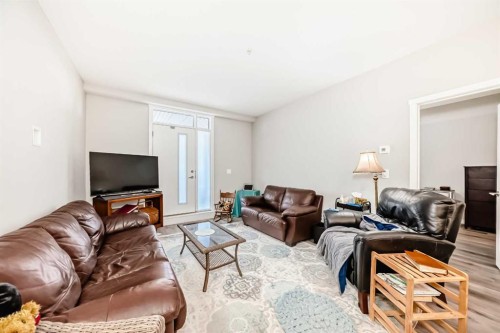 108-71 Shawnee Common Sw, Calgary, AB - Indoor Photo Showing Living Room