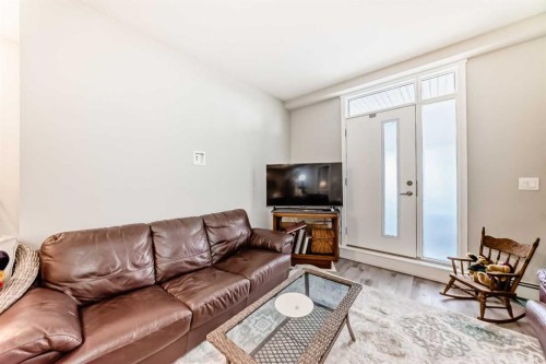 108-71 Shawnee Common Sw, Calgary, AB - Indoor Photo Showing Living Room