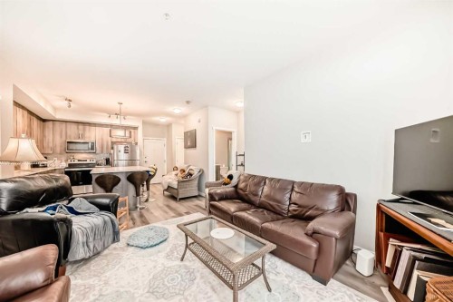 108-71 Shawnee Common Sw, Calgary, AB - Indoor Photo Showing Living Room
