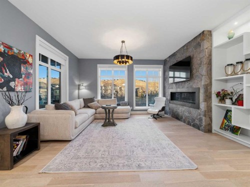 80 Cranbrook Heights Se, Calgary, AB - Indoor Photo Showing Living Room With Fireplace