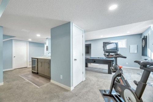 323 Hawkwood Boulevard Nw, Calgary, AB - Indoor Photo Showing Gym Room