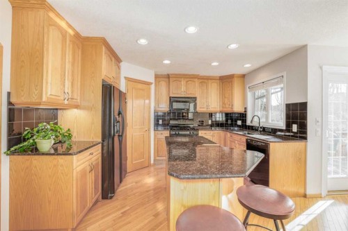 7 Chapala Terrace Se, Calgary, AB - Indoor Photo Showing Kitchen With Double Sink