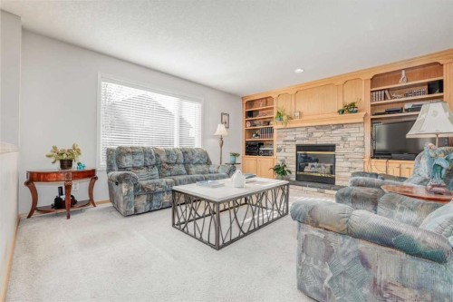 7 Chapala Terrace Se, Calgary, AB - Indoor Photo Showing Living Room With Fireplace