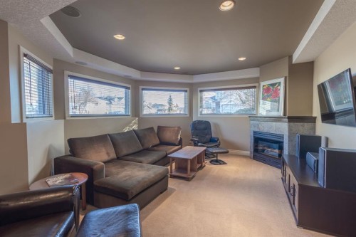 456 Hawkland Place Nw, Calgary, AB - Indoor Photo Showing Living Room With Fireplace