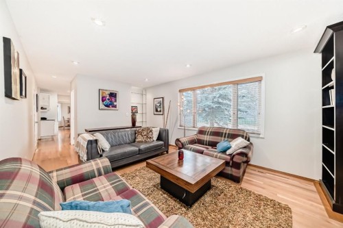 3707 37 Street Nw, Calgary, AB - Indoor Photo Showing Living Room With Fireplace