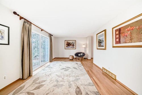 3707 37 Street Nw, Calgary, AB - Indoor Photo Showing Living Room With Fireplace