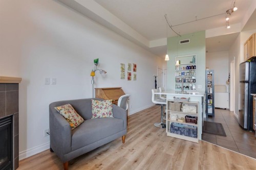 3608-24 Hemlock Crescent Sw, Calgary, AB - Indoor Photo Showing Living Room With Fireplace