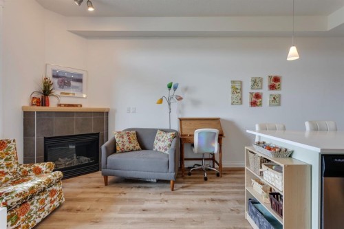3608-24 Hemlock Crescent Sw, Calgary, AB - Indoor Photo Showing Living Room With Fireplace