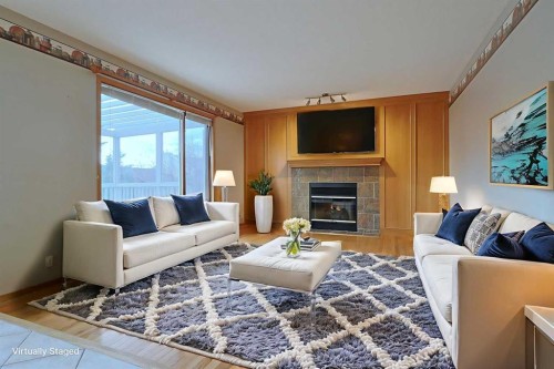 111 Schubert Place Nw, Calgary, AB - Indoor Photo Showing Living Room With Fireplace