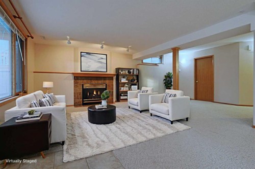 111 Schubert Place Nw, Calgary, AB - Indoor Photo Showing Living Room With Fireplace