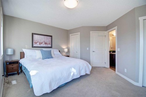 1606-2445 Kingsland Road Se, Airdrie, AB - Indoor Photo Showing Bedroom