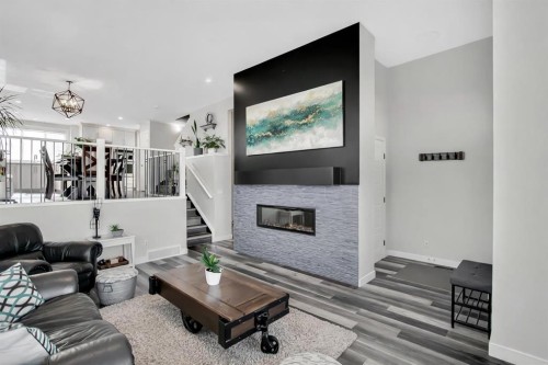 273 Masters Road Se, Calgary, AB - Indoor Photo Showing Living Room With Fireplace