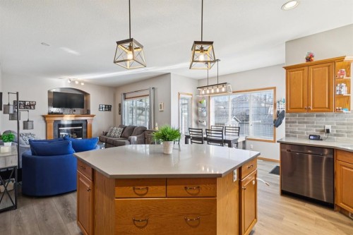 2841 Coopers Manor Sw, Airdrie, AB - Indoor With Fireplace