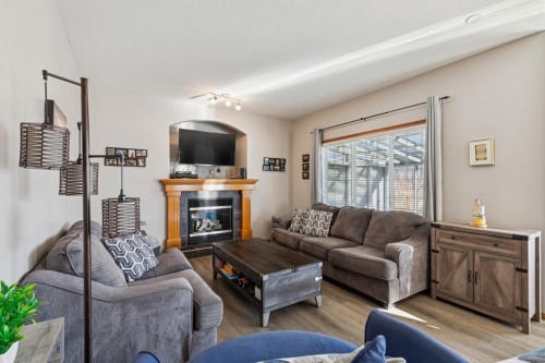 2841 Coopers Manor Sw, Airdrie, AB - Indoor Photo Showing Living Room With Fireplace