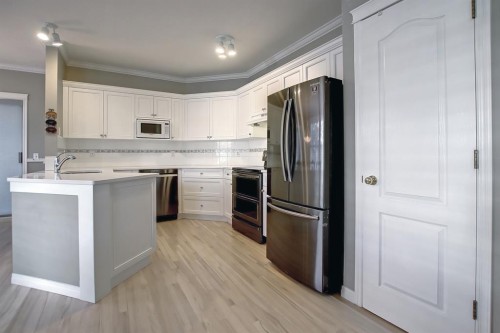 92 Prestwick Gardens Se, Calgary, AB - Indoor Photo Showing Kitchen With Stainless Steel Kitchen