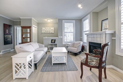 92 Prestwick Gardens Se, Calgary, AB - Indoor Photo Showing Living Room With Fireplace