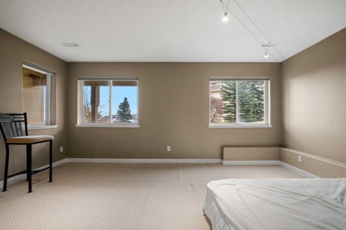702 Patterson View Sw, Calgary, AB - Indoor Photo Showing Bedroom