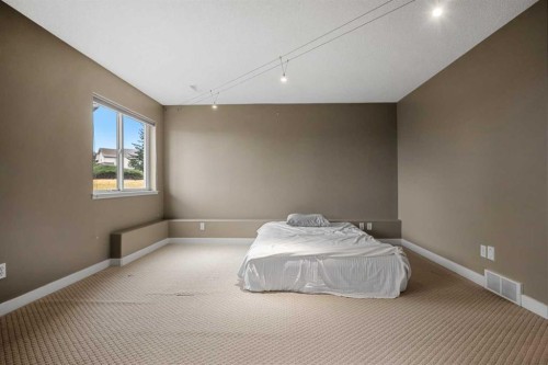 702 Patterson View Sw, Calgary, AB - Indoor Photo Showing Bedroom