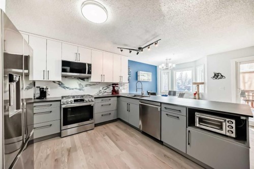 7 Sunset Crescent, Okotoks, AB - Indoor Photo Showing Kitchen With Upgraded Kitchen
