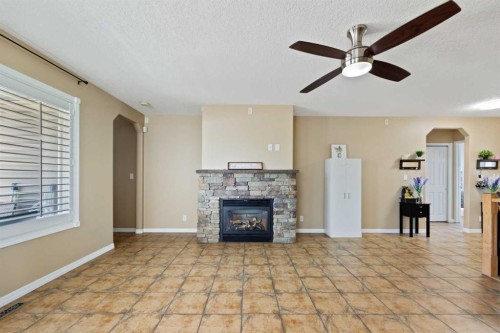 732 1 Avenue, Irricana, AB - Indoor Photo Showing Living Room With Fireplace