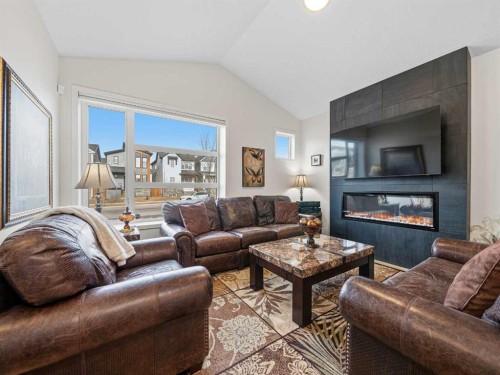 111 Haskayne Drive Nw, Calgary, AB - Indoor Photo Showing Living Room With Fireplace