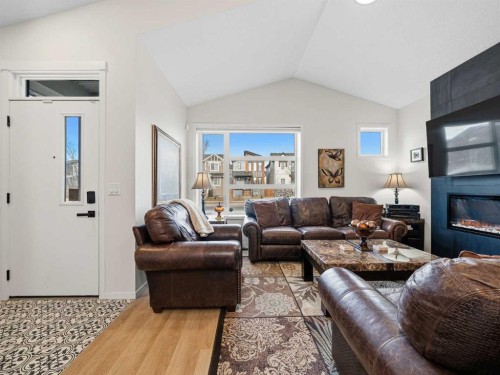 111 Haskayne Drive Nw, Calgary, AB - Indoor Photo Showing Living Room With Fireplace