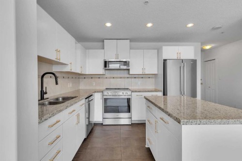 2004-77 Spruce Place Sw, Calgary, AB - Indoor Photo Showing Kitchen With Double Sink With Upgraded Kitchen