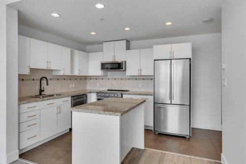 2004-77 Spruce Place Sw, Calgary, AB - Indoor Photo Showing Kitchen With Upgraded Kitchen