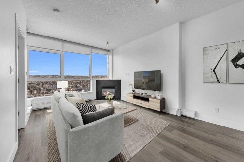 2004-77 Spruce Place Sw, Calgary, AB - Indoor Photo Showing Living Room With Fireplace