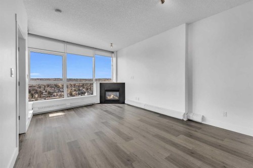 2004-77 Spruce Place Sw, Calgary, AB - Indoor Photo Showing Living Room With Fireplace