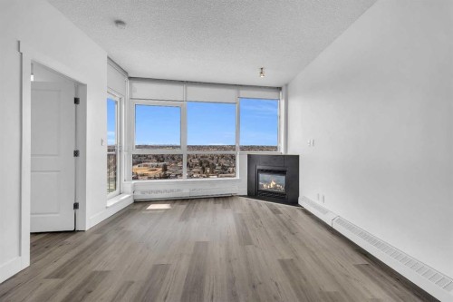 2004-77 Spruce Place Sw, Calgary, AB - Indoor Photo Showing Living Room With Fireplace