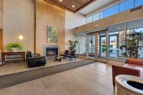 2004-77 Spruce Place Sw, Calgary, AB - Indoor With Fireplace