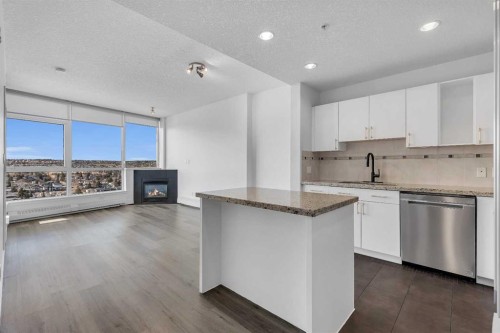 2004-77 Spruce Place Sw, Calgary, AB - Indoor Photo Showing Kitchen With Fireplace