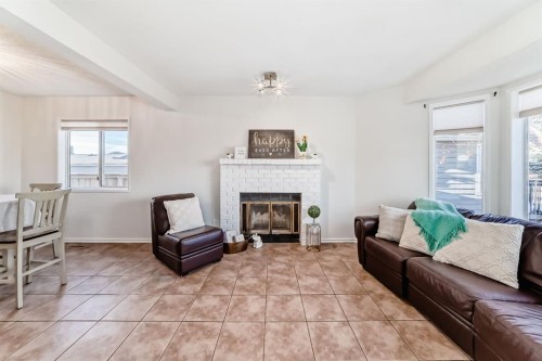 11 Martinridge Place Ne, Calgary, AB - Indoor Photo Showing Living Room With Fireplace