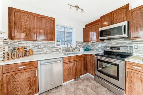 11 Martinridge Place Ne, Calgary, AB - Indoor Photo Showing Kitchen With Stainless Steel Kitchen With Double Sink
