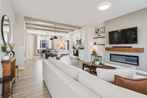 512 River Avenue, Cochrane, AB - Indoor Photo Showing Living Room With Fireplace