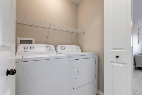 730 Belmont Drive Sw, Calgary, AB - Indoor Photo Showing Laundry Room