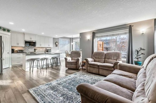 115 Cougarstone Square Sw, Calgary, AB - Indoor Photo Showing Living Room