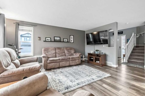 115 Cougarstone Square Sw, Calgary, AB - Indoor Photo Showing Living Room