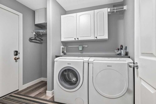 115 Cougarstone Square Sw, Calgary, AB - Indoor Photo Showing Laundry Room