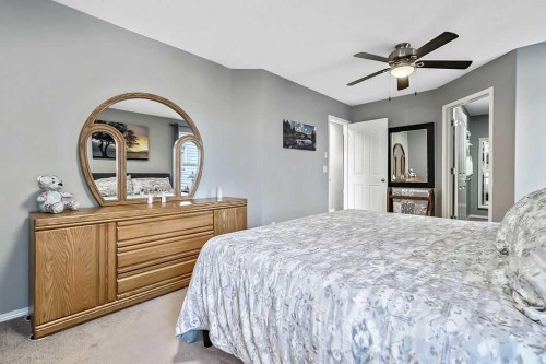 115 Cougarstone Square Sw, Calgary, AB - Indoor Photo Showing Bedroom