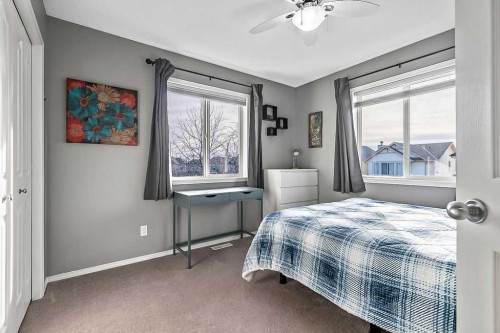 115 Cougarstone Square Sw, Calgary, AB - Indoor Photo Showing Bedroom