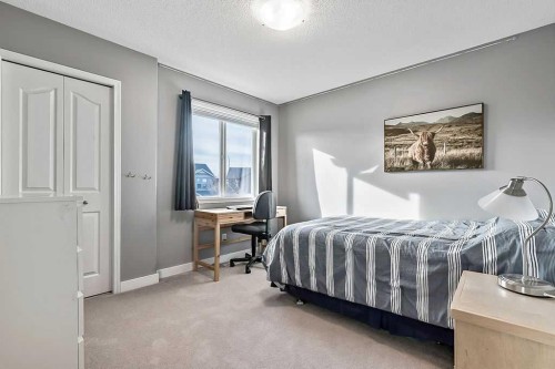 115 Cougarstone Square Sw, Calgary, AB - Indoor Photo Showing Bedroom