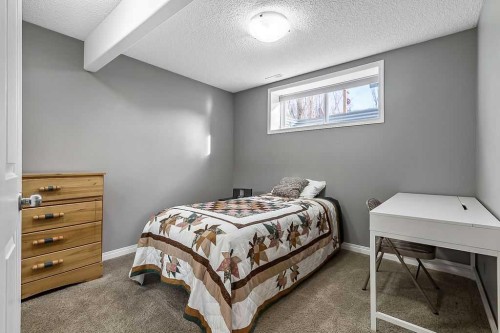 115 Cougarstone Square Sw, Calgary, AB - Indoor Photo Showing Bedroom