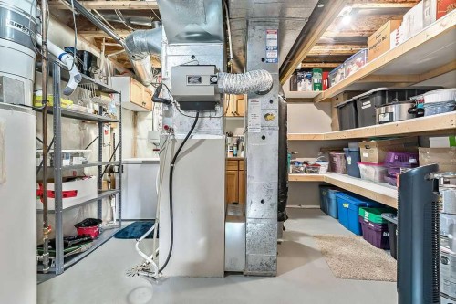 115 Cougarstone Square Sw, Calgary, AB - Indoor Photo Showing Basement